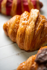 Croissant bakery on white wooden table