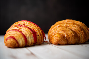 Croissant bakery on white wooden table