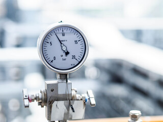 Pressure gauge of measuring instrument close up in industry zone at power plant with closed up