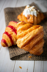 Croissant bakery on white wooden table