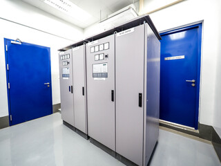 Electrical panel of inverter and battery charger systems for storage power from battery in power plant.