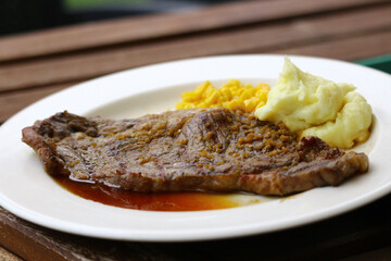 grilled steak with fries