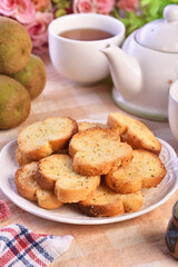 Round rusks with pesto sauce flavor on white plate  
