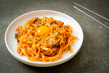 stir-fried udon noodles with kimchi and pork