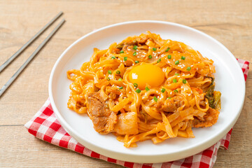stir-fried udon noodles with kimchi and pork