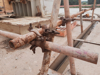 rusty scaffolding clamps are still used, dangerous to work safety