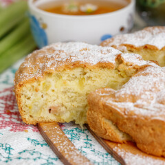 Piece of homemade biscuit cake with rhubarb