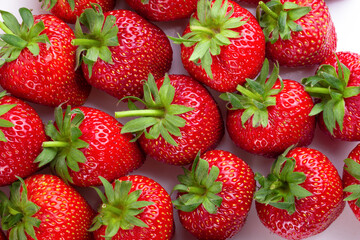 Ripe red strawberries on a white background