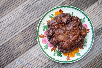 Overhead view of an apple fritter pastry for breakfast at the donut shop