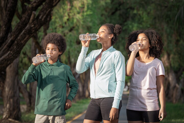 group of friends drinking water at outdoor  