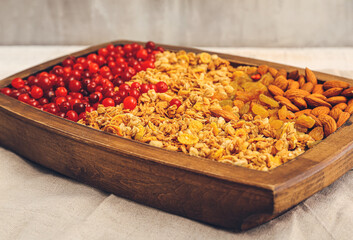 Tray with tasty granola on table