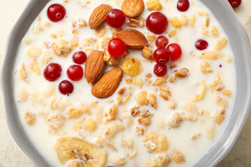 Tasty granola with milk, closeup