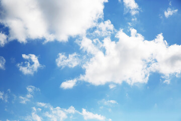 Blue sky and clouds background with lots of copy space.