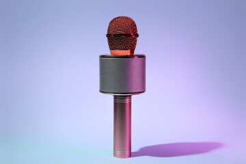 Modern microphone on color background