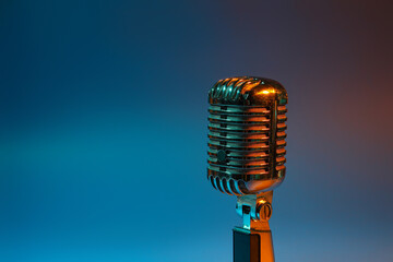 Retro microphone on dark color background