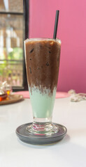 A glass of iced chocolate with milk and peppermint syrup