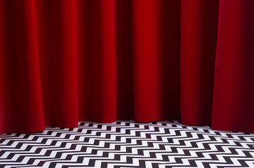 Theatre scene with red velvet curtain and black and white tile on floor. Stage for displaying...