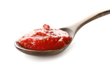 Spoon with tasty tomato sauce on white background