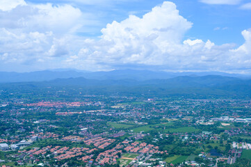 Aerial view photo from airplane of city and clear sky.