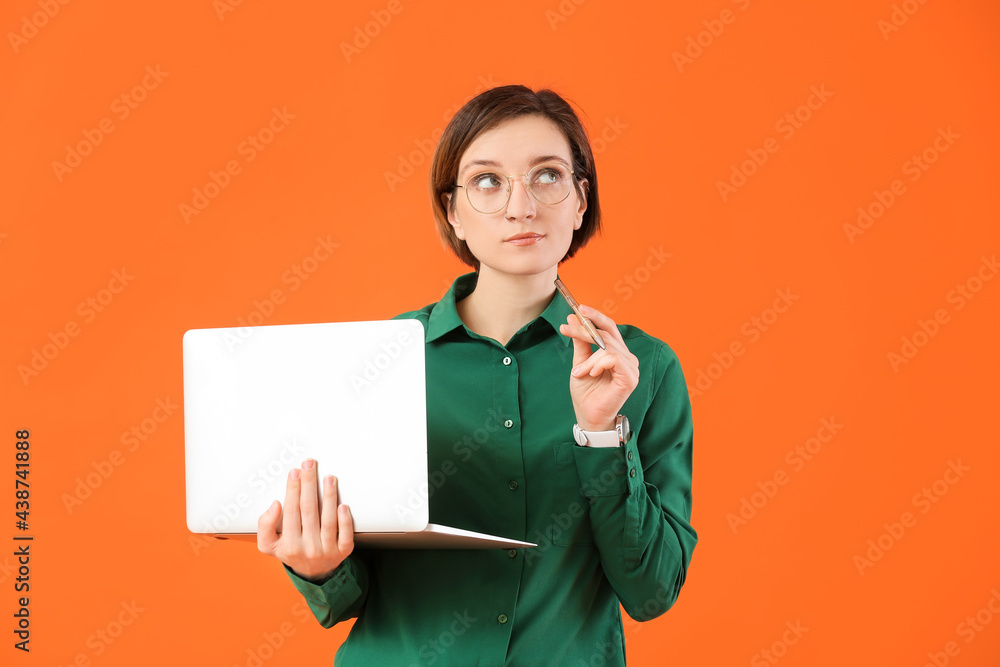 Poster thoughtful female programmer with laptop on color background