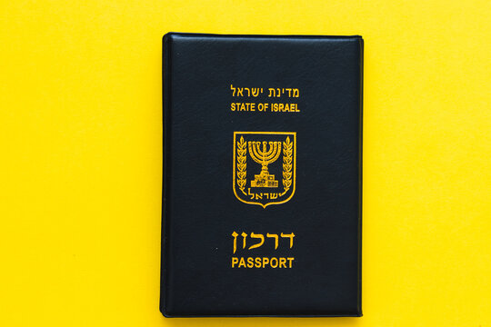 jerusalem-israel. 03-02-2021. Blue Israeli passport with gold stamping on a yellow background