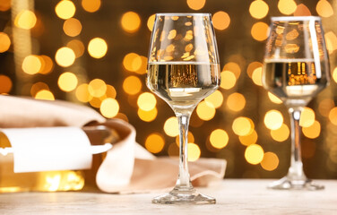 Glasses of wine against defocused lights