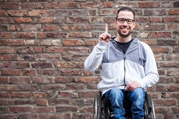 man in wheelchair counting on his fingers