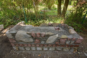 Little smokehouse during construction in a garden rural house 