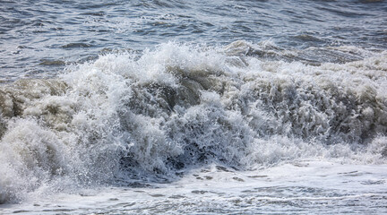 Splashing big waves on the seashore.