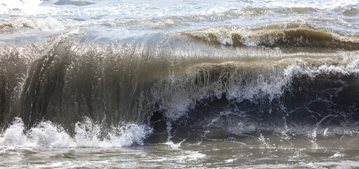 Splashing big waves on the seashore.