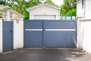 Fototapeta na wymiar portal street suburb home grey house wicket gate garden access door