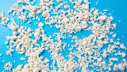 Milk curd on a blue background.