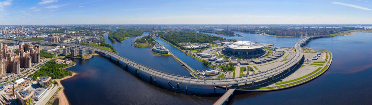 Panoramic aerial view of Gazprom Arena and Western High-Speed Diameter (ZSD) on sunny day. Saint Petersburg, Russia.