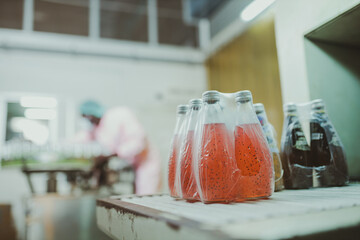 African american worker inspecting production line at drinks production factory. working Concept