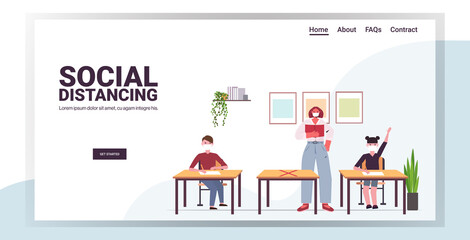 teacher and pupils in protective masks keeping distance to prevent coronavirus pandemic social distancing