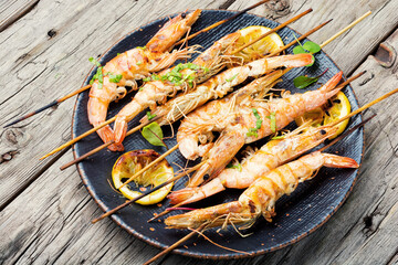 Large langoustines on a plate,wooden table