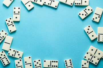 Domino pieces on blue background with an empty space for text