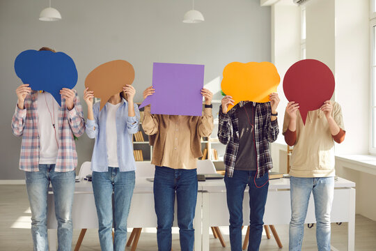 Opinion Research And Study. Teen Students Holding Clean Speech Balloons. Group Of Young Men And Women Hiding Face Behind Colorful Bubbles. People Sharing Message. Youth Generation Expressing Thoughts