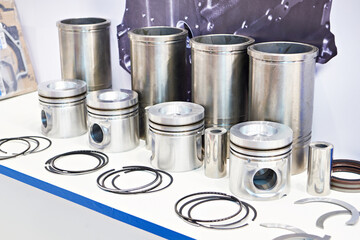 Pistons, sleeves and oil scraper rings on store