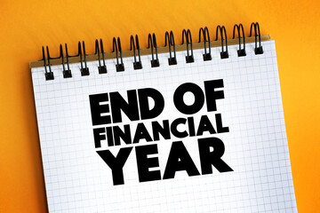 End Of Financial Year text quote on notepad, concept background.