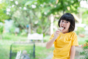 Fototapeta premium kid eating ice cream, delicious and happy concept
