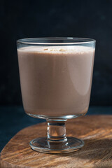chocolate milkshake in a glass, vertical
