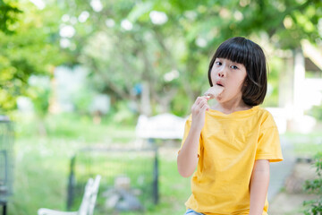 Fototapeta premium kid eating ice cream, delicious and happy concept