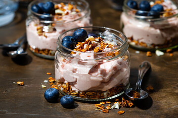dessert with strawberry mousse and granola, top view