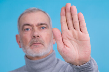 man making denial or stop sign with hand isolated