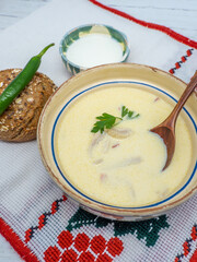 romanian trips soup served with green pepper and cream