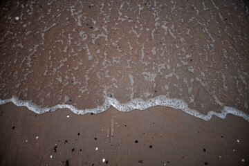 Sand and tidal sea wave. Vacation and summertime designers template. Copy space for sand sign