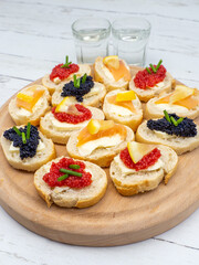 assorted bruschetta with fish fillet and fish roe