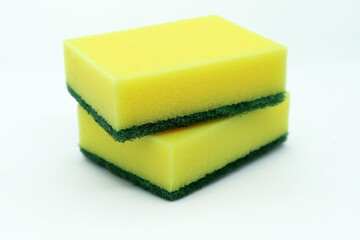 Yellow washing sponges for dishes on white background