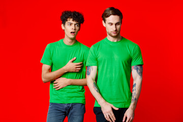 two men green t-shirt communication studio team